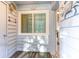 Inviting entryway featuring nautical decor, a window, and a glimpse into the home's interior at 9581 Shore Dr. # 223, Myrtle Beach, SC 29572