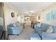 Spacious living room with open floor plan, sofas, ceiling fan, and view to the kitchen at 9581 Shore Dr. # 223, Myrtle Beach, SC 29572
