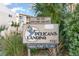 Pelican's Landing signage for units and parking located within landscaped grounds at 9581 Shore Dr. # 223, Myrtle Beach, SC 29572