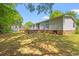 Large backyard featuring a brick-lined patio, storage shed, and lush green lawn at 976 South Marlin Circle, Murrells Inlet, SC 29576