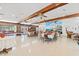 Bright event space with tables, large mural, exposed beams, and brick wall at 976 South Marlin Circle, Murrells Inlet, SC 29576