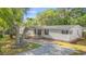 Charming single-story home with covered porch and meticulously landscaped front yard at 976 South Marlin Circle, Murrells Inlet, SC 29576