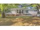 Single-story home with a quaint front porch, brick accents, and lush lawn at 976 South Marlin Circle, Murrells Inlet, SC 29576