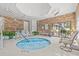 Indoor pool with comfortable lounge seating and lovely potted plants at 976 South Marlin Circle, Murrells Inlet, SC 29576
