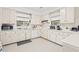 Traditional white kitchen with ample cabinet space, appliances, and bright natural light at 976 South Marlin Circle, Murrells Inlet, SC 29576