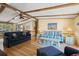 Inviting living room with exposed beam ceiling, hardwood floors, and open layout at 976 South Marlin Circle, Murrells Inlet, SC 29576