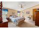 Cozy bedroom with a bed, nightstands, ceiling fan, and a connecting bathroom at 976 South Marlin Circle, Murrells Inlet, SC 29576