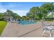 Outdoor pool with lots of lounge seating and mature shady trees at 976 South Marlin Circle, Murrells Inlet, SC 29576