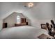 Large bonus room with vaulted ceiling, a window for natural light, and versatile space for living or recreation at 1001 Harvest View Ave., Conway, SC 29527