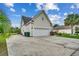 Attached two-car garage with a large driveway and manicured landscaping at 1001 Harvest View Ave., Conway, SC 29527