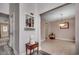 Hallway with wood-look floors leads to dining room with tile flooring and an adjacent doorway at 1001 Harvest View Ave., Conway, SC 29527