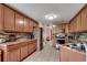 Spacious kitchen features wooden cabinets and stainless steel appliances at 1001 Harvest View Ave., Conway, SC 29527