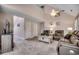 Cozy living room boasts vaulted ceilings, carpet, neutral walls, and comfortable leather furniture at 1001 Harvest View Ave., Conway, SC 29527