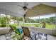 Inviting screened porch with seating, ceiling fan, and views of the surrounding landscape at 1001 Harvest View Ave., Conway, SC 29527