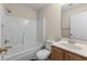 Clean bathroom with a tub-shower, wood vanity, and neutral wall color at 1004 Harvester Circle # 1004, Myrtle Beach, SC 29579