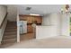 Open kitchen featuring stainless steel appliances and breakfast bar with easy access to stairs at 1004 Harvester Circle # 1004, Myrtle Beach, SC 29579