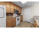 Functional kitchen featuring essential appliances and ample cabinet space at 1004 Harvester Circle # 1004, Myrtle Beach, SC 29579