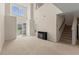 Bright living room with fireplace, staircase, and an open entryway providing easy access to the front door at 1004 Harvester Circle # 1004, Myrtle Beach, SC 29579