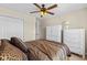 Cozy main bedroom featuring a ceiling fan, carpet flooring, and closet storage at 1004 Harvester Circle # 1004, Myrtle Beach, SC 29579