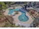 Aerial view of community pools, splash pad, playground, and clubhouse at 1004 Harvester Circle # 1004, Myrtle Beach, SC 29579