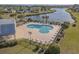 Aerial view of the neighborhood pool, lounge chairs, and lake at 1004 Harvester Circle # 1004, Myrtle Beach, SC 29579