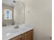 Bright powder room featuring a vanity with a white sink and decorative mirror at 1004 Harvester Circle # 1004, Myrtle Beach, SC 29579
