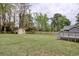 Expansive backyard includes a storage shed, wooden privacy fence, and deck, perfect for outdoor activities and relaxation at 1028 1St Ave. S, North Myrtle Beach, SC 29582