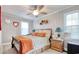 Inviting bedroom featuring a ceiling fan, natural light, and thoughtful décor for a cozy and relaxing space at 1028 1St Ave. S, North Myrtle Beach, SC 29582