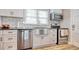 Updated kitchen featuring stainless steel appliances, subway tile backsplash, and modern countertops at 1028 1St Ave. S, North Myrtle Beach, SC 29582