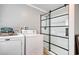 The laundry area is conveniently situated near a shower with sleek black hardware for ease and accessibility at 1028 1St Ave. S, North Myrtle Beach, SC 29582