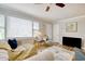 Bright living room with large windows, neutral furniture, and wood-look flooring at 1028 1St Ave. S, North Myrtle Beach, SC 29582