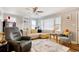 Comfortable living room with ceiling fan, ample seating, natural light, and modern decor at 1028 1St Ave. S, North Myrtle Beach, SC 29582