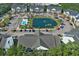 Community view showing pool, pond, landscaping and buildings at 106 Birch N Coppice Dr. # 2, Surfside Beach, SC 29575