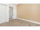 Bright bedroom featuring a bathroom with white trims and neutral walls at 106 Birch N Coppice Dr. # 2, Surfside Beach, SC 29575
