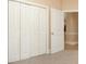 View of bedroom with closet and doorway leading to another room at 106 Birch N Coppice Dr. # 2, Surfside Beach, SC 29575