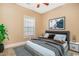 Inviting bedroom with cozy decor, a ceiling fan, and a picture window for natural light at 106 Birch N Coppice Dr. # 2, Surfside Beach, SC 29575