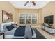 Cozy bedroom featuring a comfortable bed, large window, and stylish decor at 106 Birch N Coppice Dr. # 2, Surfside Beach, SC 29575