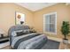 Comfortable bedroom showcasing modern decor, a decorative window, and ample natural light at 106 Birch N Coppice Dr. # 2, Surfside Beach, SC 29575