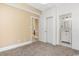 Cozy bedroom featuring a bathroom and a sliding closet door at 106 Birch N Coppice Dr. # 2, Surfside Beach, SC 29575