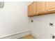 Light colored cabinets, floor and wall in the laundry room at 106 Birch N Coppice Dr. # 2, Surfside Beach, SC 29575