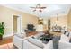 Open concept living room, dining, and kitchen area with hardwood floors and modern decor at 106 Birch N Coppice Dr. # 2, Surfside Beach, SC 29575