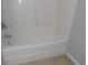 Bathroom highlighting a bright white bathtub with a shower head and tiled wall providing a clean look at 108 Pickerel Blvd., Longs, SC 29568