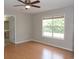 The bedroom showcases hardwood floors, a window that looks to the backyard, and bathroom access at 108 Pickerel Blvd., Longs, SC 29568