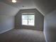 Spacious bedroom with plush carpet and a large window for natural light at 108 Pickerel Blvd., Longs, SC 29568