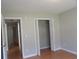 A bedroom features hardwood floors, closet with doors and access to other rooms at 108 Pickerel Blvd., Longs, SC 29568