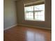 A light and airy bedroom features a window that lets in natural light and hardwood floors at 108 Pickerel Blvd., Longs, SC 29568