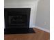 A fireplace with a white mantel and black surround complements the hardwood floors at 108 Pickerel Blvd., Longs, SC 29568