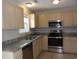 Kitchen showcasing granite countertops, stainless steel appliances, and light-colored cabinetry at 108 Pickerel Blvd., Longs, SC 29568