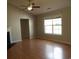 Spacious living room featuring a fireplace, ceiling fan, and natural light from a window at 108 Pickerel Blvd., Longs, SC 29568