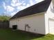 Side exterior view of the house, showing the siding, roof, and access door to the garage at 108 Pickerel Blvd., Longs, SC 29568
